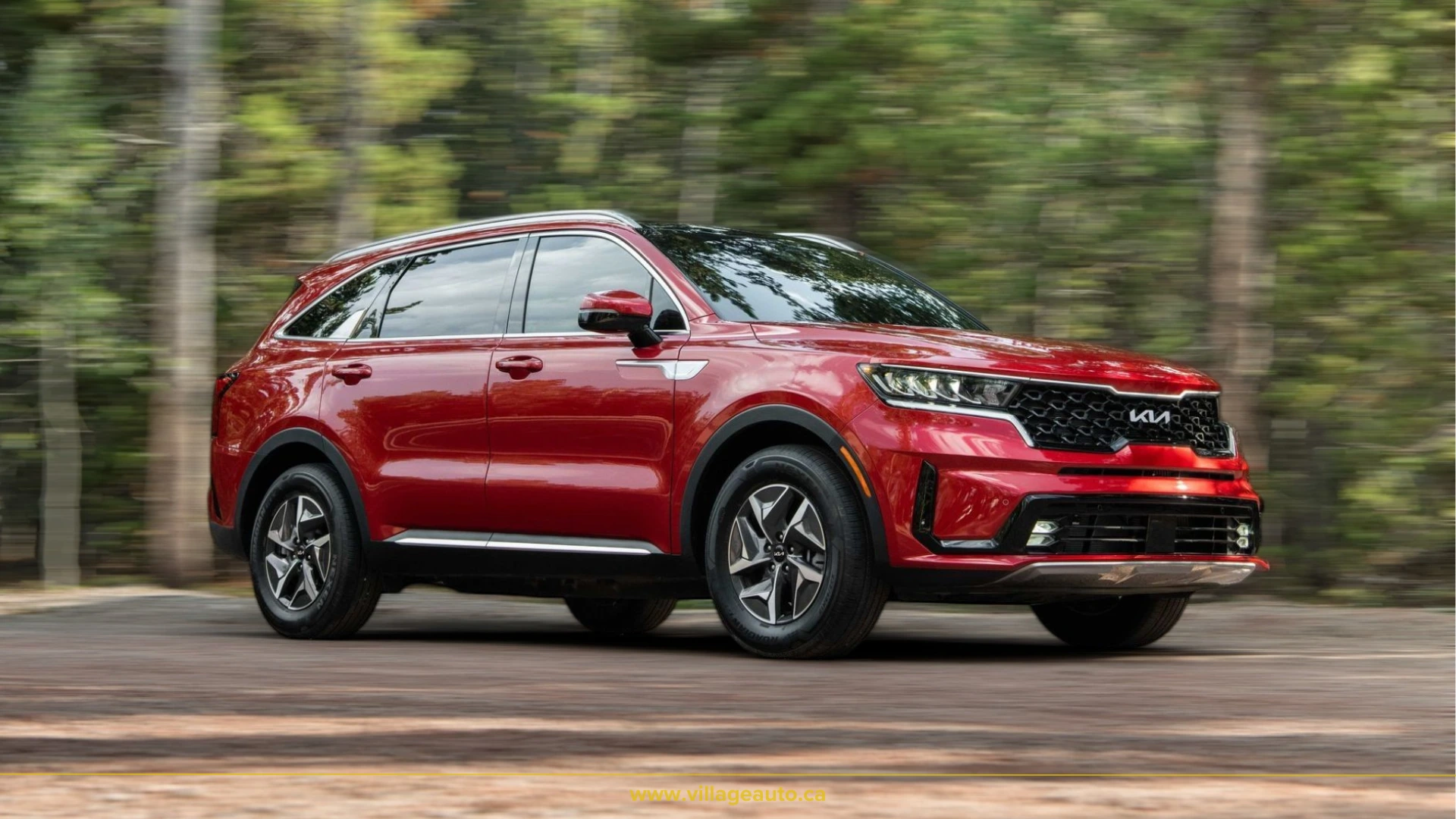 red kia sorento on the road